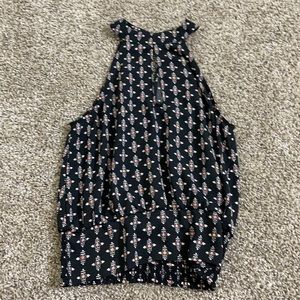 It’s a top, backless, size extra small and it’s black